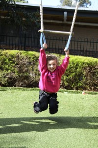 Having fun on the swing set